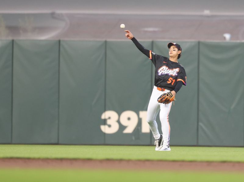 Jun 3, 2025; San Francisco, California, USA; San Francisco Giants center fielder Jung Hoo Lee (51) throws the ball infield against the San Diego Padres during the sixth inning at Oracle Park. Mandatory Credit: Kelley L Cox-Imagn Images