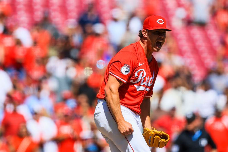 Aug 31, 2025; Cincinnati, Ohio, USA; Cincinnati Reds relief pitcher Emilio Pagan (15) reacts after the victory over the St. Louis Cardinals at Great American Ball Park. Mandatory Credit: Katie Stratman-Imagn Images