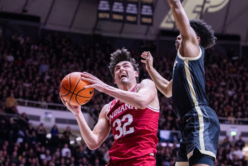 Feb 10, 2024; West Lafayette, Indiana, USA; Indiana Hoosiers guard Trey Galloway (32) shoots the ball while Purdue Boilermakers guard Myles Colvin (5) defends in the first half at Mackey Arena. Mandatory Credit: Trevor Ruszkowski-USA TODAY Sports