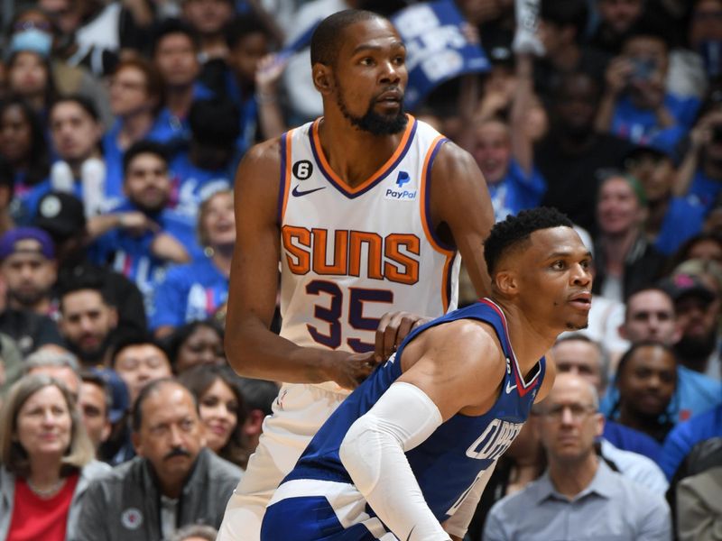 LOS ANGELES, CA - APRIL 20: Kevin Durant #35 of the Phoenix Suns and Russell Westbrook  #0 of the LA Clippers look on during Round 1 Game 3 of the 2023 NBA Playoffs on April 20, 2023 at Crypto.Com Arena in Los Angeles, California. NOTE TO USER: User expressly acknowledges and agrees that, by downloading and/or using this Photograph, user is consenting to the terms and conditions of the Getty Images License Agreement. Mandatory Copyright Notice: Copyright 2023 NBAE (Photo by Andrew D. Bernstein/NBAE via Getty Images)