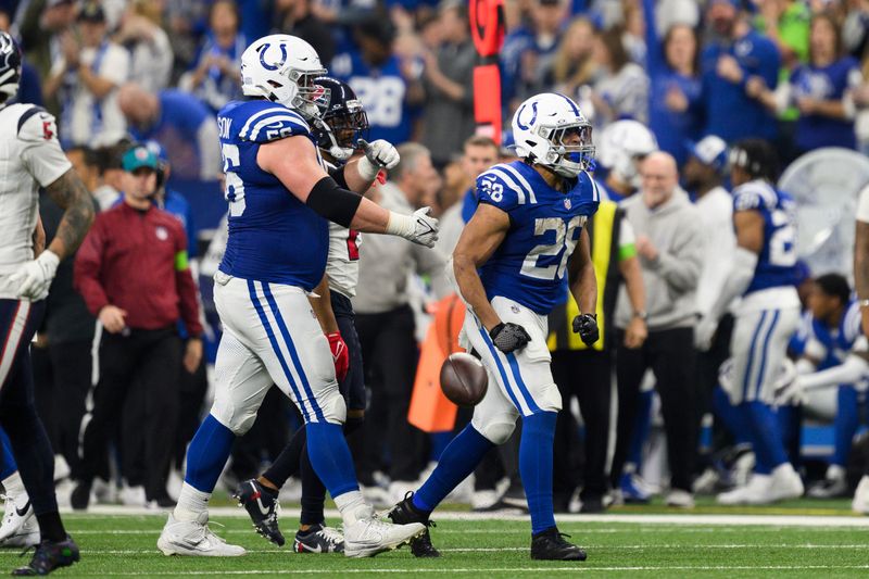 Indianapolis Colts running back Jonathan Taylor (28) celebrates a first down during an NFL football game against the Houston Texans, Saturday, Jan. 6, 2024, in Indianapolis. (AP Photo/Zach Bolinger)