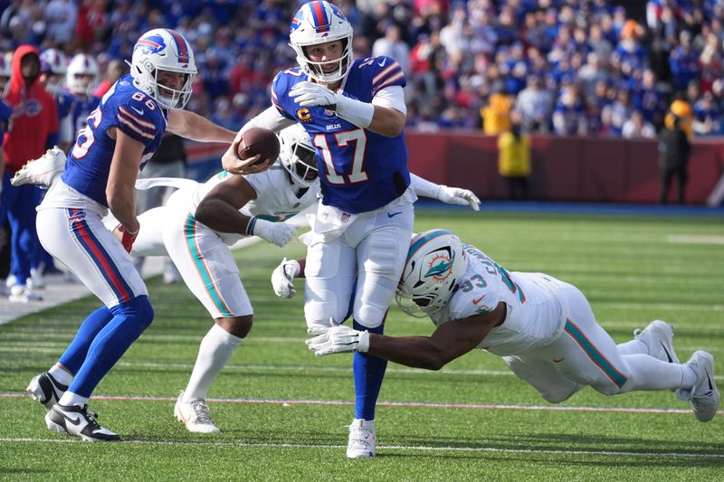 Buffalo Bills quarterback Josh Allen (17) is tackled by Miami Dolphins defensive tackle Calais Campbell (93) during the first half of an NFL football game, Sunday, Nov. 3, 2024, in Orchard Park, N.Y. (AP Photo/Gene Puskar)