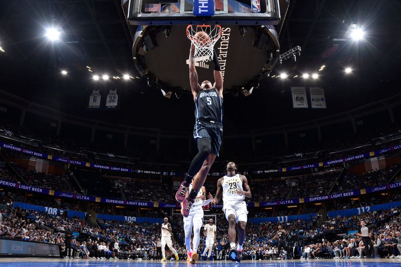 ORLANDO, FL - OCTOBER 28: Paolo Banchero #5 of the Orlando Magic dunks the ball during the game against the Indiana Pacers on October 28, 2024 at Kia Center in Orlando, Florida. NOTE TO USER: User expressly acknowledges and agrees that, by downloading and or using this photograph, User is consenting to the terms and conditions of the Getty Images License Agreement. Mandatory Copyright Notice: Copyright 2024 NBAE (Photo by Fernando Medina/NBAE via Getty Images)