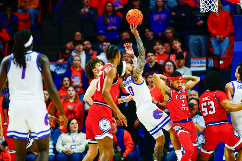 Feb 17, 2024; Boise, Idaho, USA; Boise State Broncos guard Roddie Anderson III (0) shoots over Fresno State Bulldogs guard Isaiah Hill (3) during the first half at ExtraMile Arena. Mandatory Credit: Brian Losness-USA TODAY Sports


