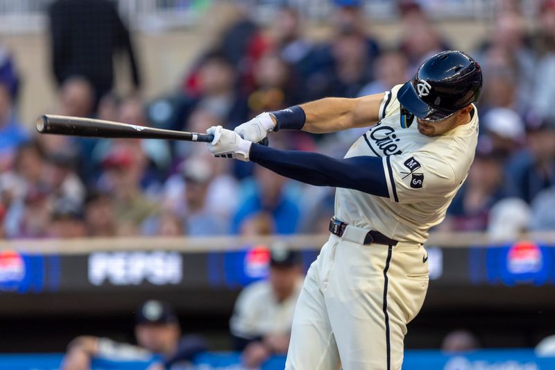 May 29, 2024; Minneapolis, Minnesota, USA; Minnesota Twins left fielder Trevor Larnach (9) hits a single against the Kansas City Royals in the fifth inning at Target Field. Mandatory Credit: Jesse Johnson-USA TODAY Sports