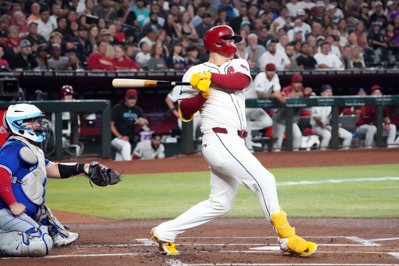 Jul 13, 2024; Phoenix, Arizona, USA; Arizona Diamondbacks designated hitter Joc Pederson (3) hits an RBI double against the Toronto Blue Jays during the first inning at Chase Field. Mandatory Credit: Joe Camporeale-USA TODAY Sports