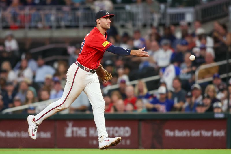 Sep 6, 2024; Atlanta, Georgia, USA; Atlanta Braves first baseman Matt Olson (28) throws a runner out at first against the Toronto Blue Jays in the fifth inning at Truist Park. Mandatory Credit: Brett Davis-Imagn Images