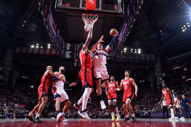 HOUSTON, TX - NOVEMBER 11: Corey Kispert #24 of the Washington Wizards drives to the basket during the game against the Houston Rockets on November 11, 2024 at the Toyota Center in Houston, Texas. NOTE TO USER: User expressly acknowledges and agrees that, by downloading and or using this photograph, User is consenting to the terms and conditions of the Getty Images License Agreement. Mandatory Copyright Notice: Copyright 2024 NBAE (Photo by Logan Riely/NBAE via Getty Images)