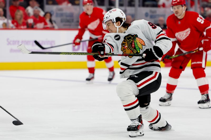 Nov 30, 2023; Detroit, Michigan, USA; Chicago Blackhawks center Connor Bedard (98) takes a shot in the third period against the Detroit Red Wings at Little Caesars Arena. Mandatory Credit: Rick Osentoski-USA TODAY Sports