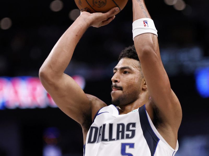 DALLAS, TX - OCTOBER 17: Quentin Grimes #5 of the Dallas Mavericks shoots the ball in the second half of an NBA preseason game against the Milwaukee Bucks at American Airlines Center on October 17, 2024 in Dallas, Texas. NOTE TO USER: User expressly acknowledges and agrees that, by downloading and or using this photograph, User is consenting to the terms and conditions of the Getty Images License Agreement. (Photo by Ron Jenkins/Getty Images)