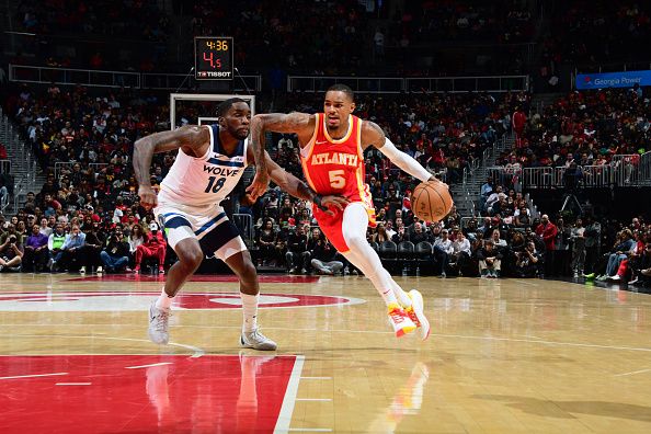 ATLANTA, GA - OCTOBER 30: Dejounte Murray #5 of the Atlanta Hawks drives to the basket during the game against the Minnesota Timberwolves on October 30, 2023 at State Farm Arena in Atlanta, Georgia.  NOTE TO USER: User expressly acknowledges and agrees that, by downloading and/or using this Photograph, user is consenting to the terms and conditions of the Getty Images License Agreement. Mandatory Copyright Notice: Copyright 2023 NBAE (Photo by Scott Cunningham/NBAE via Getty Images)