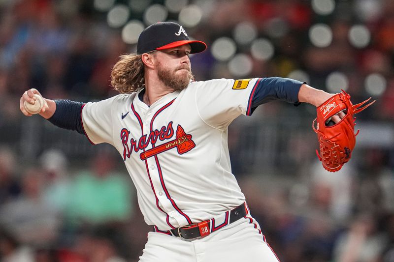 Sep 4, 2024; Cumberland, Georgia, USA; Atlanta Braves pitcher Pierce Johnson (38) pitches against the Colorado Rockies during the seventh inning at Truist Park. Mandatory Credit: Dale Zanine-Imagn Images