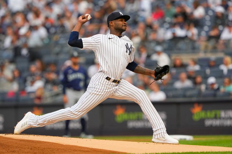 Jun 22, 2023; Bronx, New York, USA; New York Yankees pitcher Domingo German (0) delivers a pitch against the Seattle Mariners during the first inning at Yankee Stadium. Mandatory Credit: Gregory Fisher-USA TODAY Sports