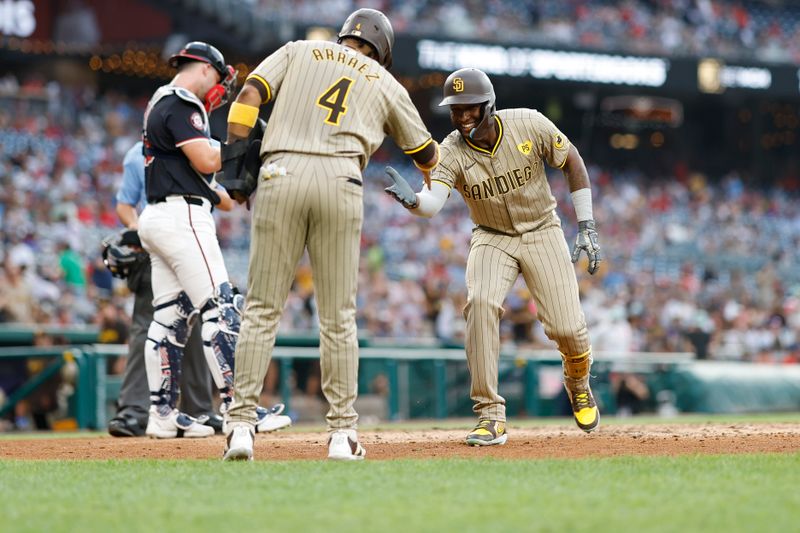 Jul 24, 2024; Washington, District of Columbia, USA; San Diego Padres outfielder Jurickson Profar (10) celebrates with Padres first baseman Luis Arraez (4) while crossing home plate after hitting a two run home run against the Washington Nationals during the second inning at Nationals Park. Mandatory Credit: Geoff Burke-USA TODAY Sports
