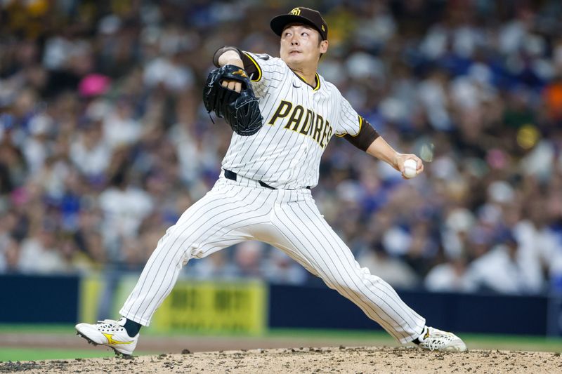 Jun 9, 2025; San Diego, California, USA; San Diego Padres relief pitcher Yuki Matsui (1) throws a pitch during the fifth inning against the Los Angeles Dodgers at Petco Park. Mandatory Credit: David Frerker-Imagn Images