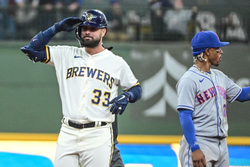 Apr 5, 2023; Milwaukee, Wisconsin, USA; Milwaukee Brewers designated hitter Jesse Winker (33) reacts after hitting a double to drive in two runs in the fifth inning against the New York Mets at American Family Field. Mandatory Credit: Benny Sieu-USA TODAY Sports