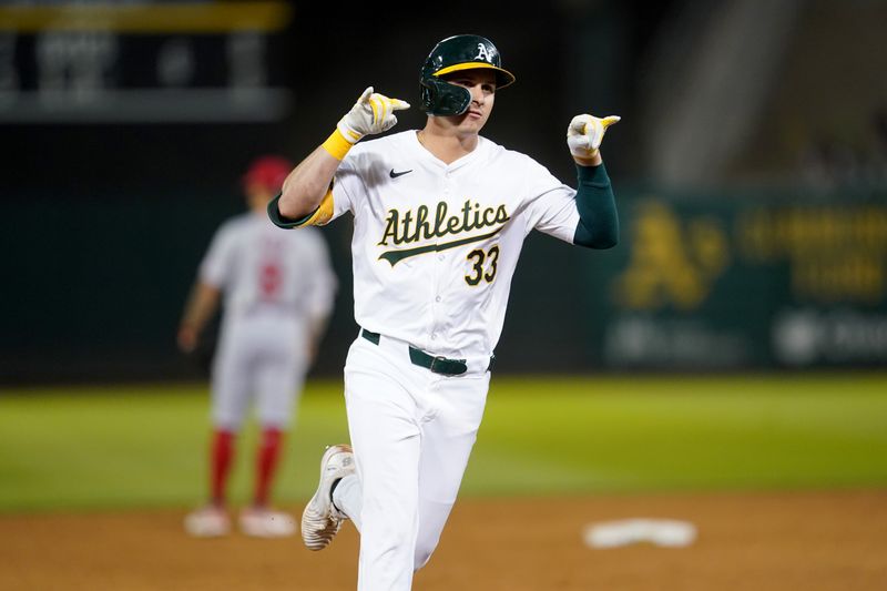 Jul 19, 2024; Oakland, California, USA; Oakland Athletics center fielder JJ Bleday (33) reacts after hitting a two-run home run against the Los Angeles Angels in the sixth inning at Oakland-Alameda County Coliseum. Mandatory Credit: Cary Edmondson-USA TODAY Sports