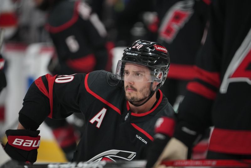 May 22, 2025; Raleigh, North Carolina, USA; Carolina Hurricanes forward Sebastian Aho (20) looks on during warm up prior to the game against the Florida Panthers in game two of the Eastern Conference Final of the 2025 Stanley Cup Playoffs at Lenovo Center. Mandatory Credit: James Guillory-Imagn Images