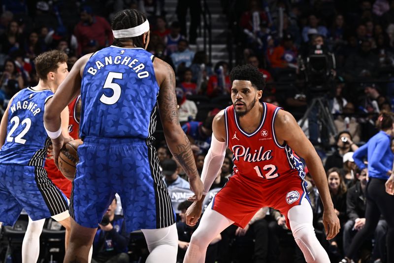 PHILADELPHIA, PA - APRIL 12: Tobias Harris #12 of the Philadelphia 76ers plays defense during the game against the Orlando Magic on April 12, 2024 at the Wells Fargo Center in Philadelphia, Pennsylvania NOTE TO USER: User expressly acknowledges and agrees that, by downloading and/or using this Photograph, user is consenting to the terms and conditions of the Getty Images License Agreement. Mandatory Copyright Notice: Copyright 2024 NBAE (Photo by David Dow/NBAE via Getty Images)