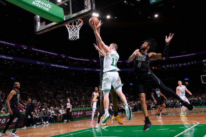 BOSTON, MA - FEBRUARY 14: Payton Pritchard #11 of the Boston Celtics drives to the basket during the game against the Brooklyn Nets on February 14, 2024 at the TD Garden in Boston, Massachusetts. NOTE TO USER: User expressly acknowledges and agrees that, by downloading and or using this photograph, User is consenting to the terms and conditions of the Getty Images License Agreement. Mandatory Copyright Notice: Copyright 2024 NBAE  (Photo by Brian Babineau/NBAE via Getty Images)