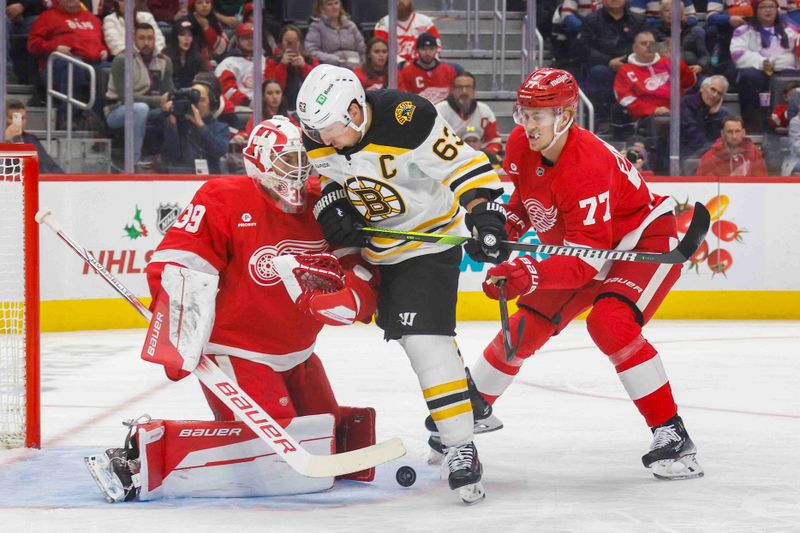 Nov 23, 2024; Detroit, Michigan, USA; Boston Bruins left wing Brad Marchand (63) takes a shot on Detroit Red Wings goaltender Cam Talbot (39) during the first period at Little Caesars Arena. Mandatory Credit: Brian Bradshaw Sevald-Imagn Images