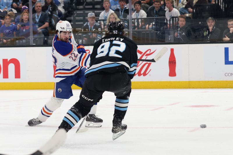 Mar 24, 2026; Salt Lake City, Utah, USA; Edmonton Oilers center Matt Savoie (22) scores a goal against Utah Mammoth center Logan Cooley (92) during the second period at Delta Center. Mandatory Credit: Rob Gray-Imagn Images