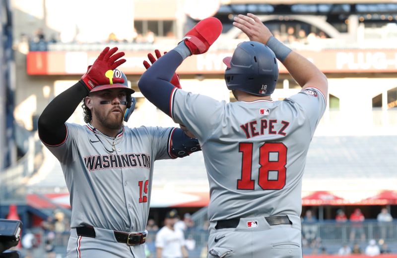 Sep 5, 2024; Pittsburgh, Pennsylvania, USA;  Washington Nationals designated hitter Andrés Chaparro (19) celebrates his two run home run with first baseman Juan Yepez (18) against the Pittsburgh Pirates during the first inning at PNC Park. Mandatory Credit: Charles LeClaire-Imagn Images