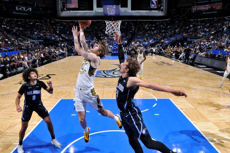 ORLANDO, FL - NOVEMBER 13: Johnny Furphy #12 of the Indiana Pacers drives to the basket during the game against the Orlando Magic on November 13, 2024 at Kia Center in Orlando, Florida. NOTE TO USER: User expressly acknowledges and agrees that, by downloading and or using this photograph, User is consenting to the terms and conditions of the Getty Images License Agreement. Mandatory Copyright Notice: Copyright 2024 NBAE (Photo by Fernando Medina/NBAE via Getty Images)