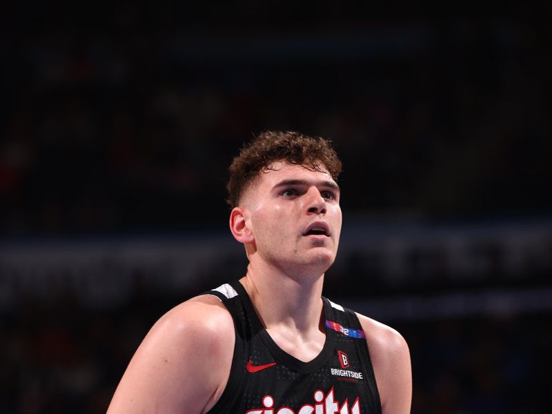 OKLAHOMA CITY, OK - NOVEMBER 20: Donovan Clingan #23 of the Portland Trail Blazers shoots a free throw during the game against the Oklahoma City Thunder on November 20, 2024 at Paycom Center in Oklahoma City, Oklahoma. NOTE TO USER: User expressly acknowledges and agrees that, by downloading and or using this photograph, User is consenting to the terms and conditions of the Getty Images License Agreement. Mandatory Copyright Notice: Copyright 2024 NBAE (Photo by Zach Beeker/NBAE via Getty Images)