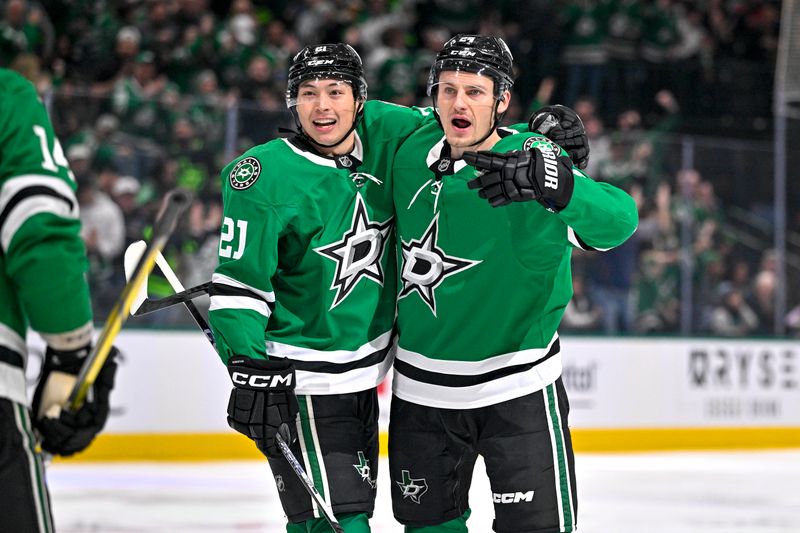 Dec 14, 2024; Dallas, Texas, USA; Dallas Stars left wing Jason Robertson (21) and center Roope Hintz (24) celebrates a goal scored by Robertson against the St. Louis Blues during the second period at American Airlines Center. Mandatory Credit: Jerome Miron-Imagn Images