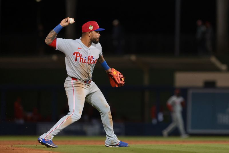 Feb 22, 2026; West Palm Beach, Florida, USA; Philadelphia Phillies third baseman Edmundo Sosa (33) throws to first base to retire Washington Nationals center fielder Dylan Crews (not pictured) during the third inning at CACTI Park of the Palm Beaches. Mandatory Credit: Sam Navarro-Imagn Images
