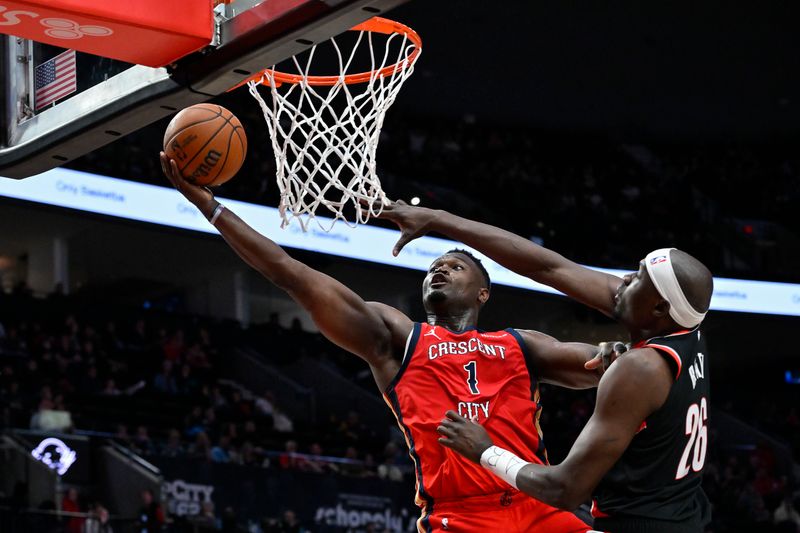 PORTLAND, OREGON - APRIL 09: Zion Williamson #1 of the New Orleans Pelicans shoots against Duop Reath #26 of the Portland Trail Blazers during the fourth quarter of the game at the Moda Center on April 09, 2024 in Portland, Oregon. The New Orleans Pelicans won 110-100. NOTE TO USER: User expressly acknowledges and agrees that, by downloading and or using this photograph, User is consenting to the terms and conditions of the Getty Images License Agreement. (Photo by Alika Jenner/Getty Images)