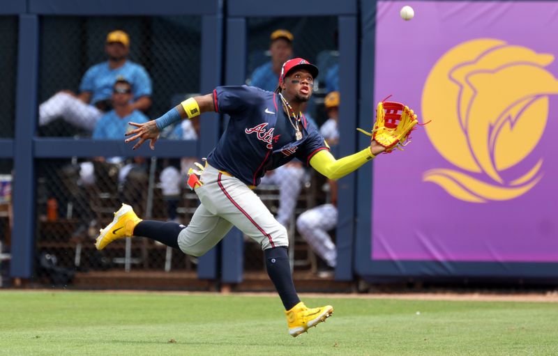 Mar 18, 2024; Port Charlotte, Florida, USA;  Atlanta Braves outfielder Ronald Acuna Jr. (13) catches a fly ball during the fourth inning against the Tampa Bay Rays at Charlotte Sports Park. Mandatory Credit: Kim Klement Neitzel-USA TODAY Sports