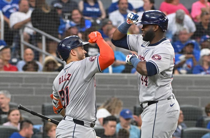 Jul 3, 2024; Toronto, Ontario, CAN; Houston Astros left fielder Jordan Alvarez (44) celebrates a sixth inning home run against the Toronto Blue Jays with designated hitter Yalner Diaz (21) at Rogers Centre. Mandatory Credit: Gerry Angus-USA TODAY Sports