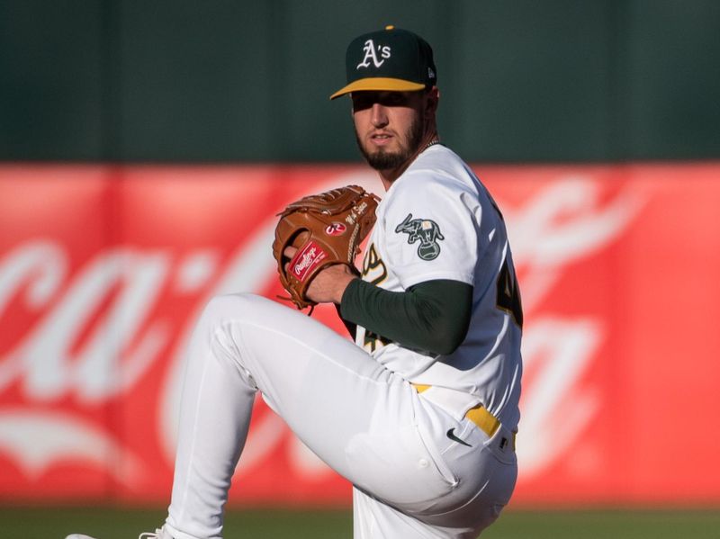 Jul 2, 2024; Oakland, California, USA; Oakland Athletics starting pitcher Mitch Spence (40) pitches against the Los Angeles Angels during the first inning at Oakland-Alameda County Coliseum. Mandatory Credit: Ed Szczepanski-USA TODAY Sports