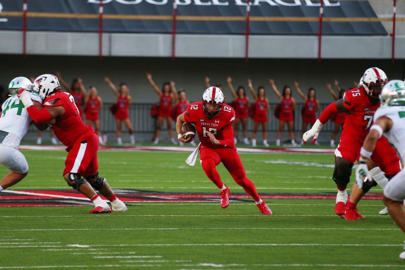 Sep 9, 2023; Lubbock, Texas, USA; Texas Tech Red Raiders quarterback Tyler Shough (12) rushes against the Oregon Ducks in the first half at Jones AT&T Stadium and Cody Campbell Field. Mandatory Credit: Michael C. Johnson-USA TODAY Sports