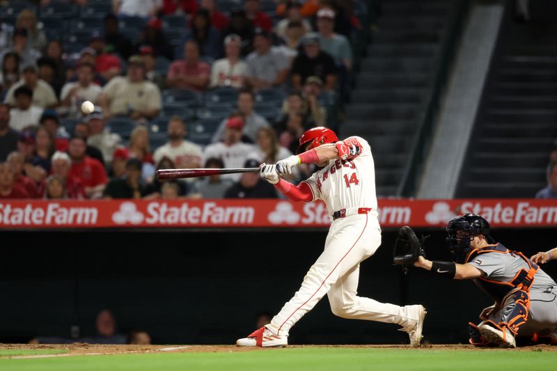 Jun 28, 2024; Anaheim, California, USA;  Los Angeles Angels catcher Logan O'Hoppe (14) hits a three-run home run during the eighth inning against the Detroit Tigers at Angel Stadium. Mandatory Credit: Kiyoshi Mio-USA TODAY Sports