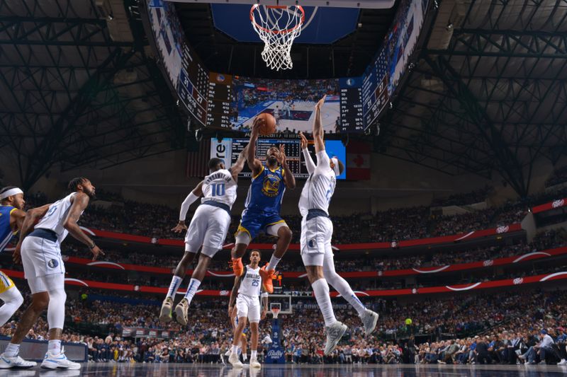 DALLAS, TX - MARCH 13: Andrew Wiggins #22 of the Golden State Warriors drives to the basket during the game against the Dallas Mavericks on March 13, 2024 at the American Airlines Center in Dallas, Texas. NOTE TO USER: User expressly acknowledges and agrees that, by downloading and or using this photograph, User is consenting to the terms and conditions of the Getty Images License Agreement. Mandatory Copyright Notice: Copyright 2024 NBAE (Photo by Glenn James/NBAE via Getty Images)