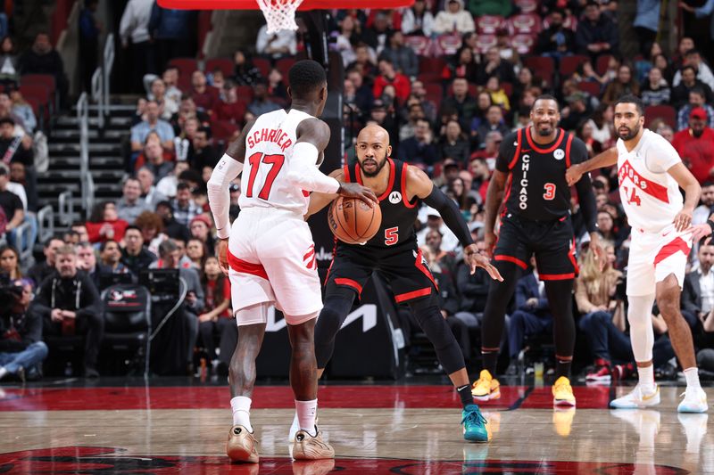 CHICAGO, IL - JANUARY 30: Jevon Carter #5 of the Chicago Bulls plays defense during the game against the Toronto Raptors on January 30, 2024 at United Center in Chicago, Illinois. NOTE TO USER: User expressly acknowledges and agrees that, by downloading and or using this photograph, User is consenting to the terms and conditions of the Getty Images License Agreement. Mandatory Copyright Notice: Copyright 2024 NBAE (Photo by Jeff Haynes/NBAE via Getty Images)