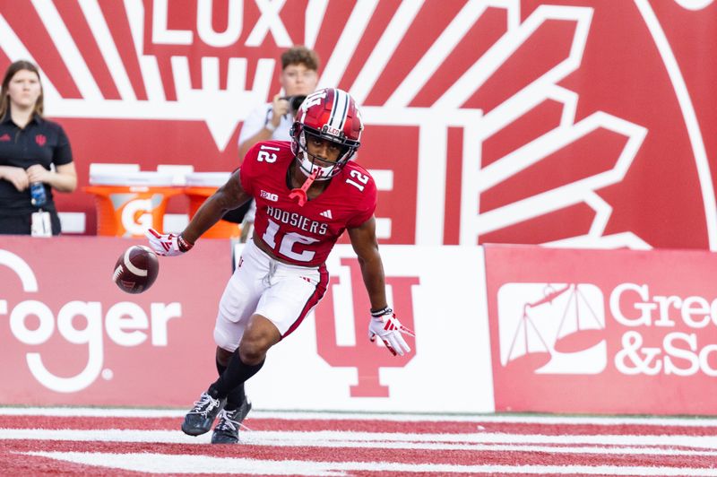 Sep 8, 2023; Bloomington, Indiana, USA; Indiana Hoosiers running back Jaylin Lucas (12) celebrates his touchdown in the first half against the Indiana State Sycamores at Memorial Stadium. Mandatory Credit: Trevor Ruszkowski-USA TODAY Sports