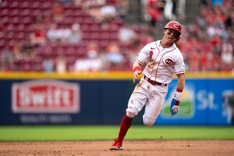 Aug 9, 2023; Cincinnati, OH, USA; Cincinnati Reds second baseman Matt McLain (9) runs towards third after advancing from first to third on a Cincinnati Reds first baseman Joey Votto (19) base hit in the sixth inning of the MLB baseball game between Cincinnati Reds and Miami Marlins at Great American Ball Park in Cincinnati on Wednesday, Aug. 9, 2023.  Mandatory Credit: Albert Cesare-USA TODAY Sports