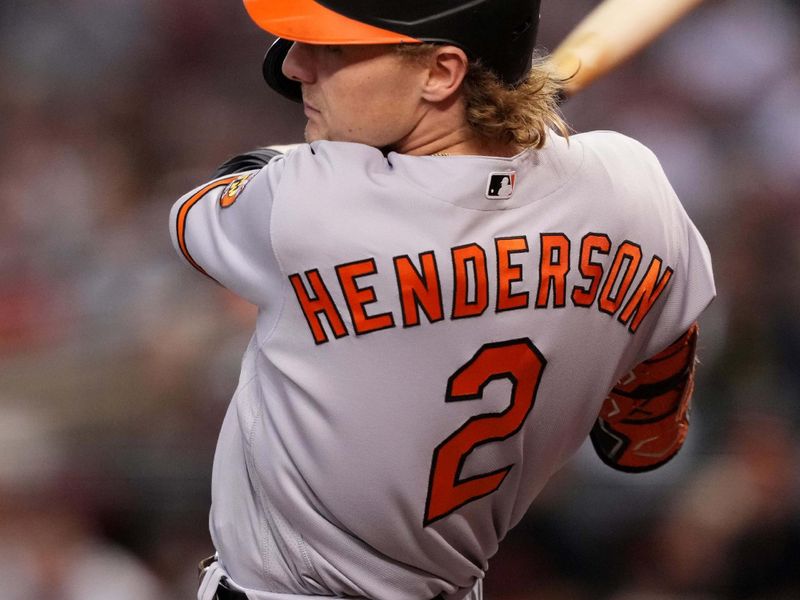 Sep 1, 2023; Phoenix, Arizona, USA; Baltimore Orioles third baseman Gunnar Henderson (2) hits a single against the Arizona Diamondbacks during the first inning at Chase Field. Mandatory Credit: Joe Camporeale-USA TODAY Sports