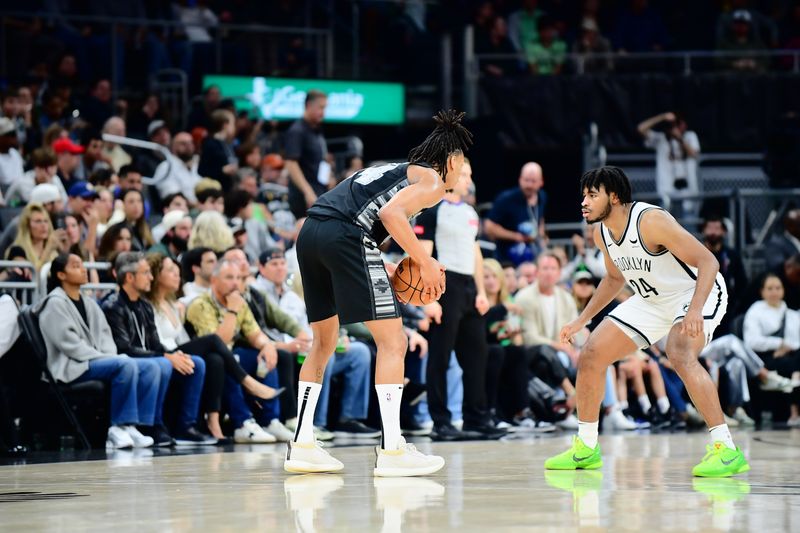 AUSTIN, TX - MARCH 17: Cam Thomas #24 of the Brooklyn Nets plays defense against Devin Vassell #24 of the San Antonio Spurs during the game on March 17, 2024 at the Moody Center in Austin, Texas. NOTE TO USER: User expressly acknowledges and agrees that, by downloading and or using this photograph, user is consenting to the terms and conditions of the Getty Images License Agreement. Mandatory Copyright Notice: Copyright 2024 NBAE (Photos by Michael Gonzales/NBAE via Getty Images)