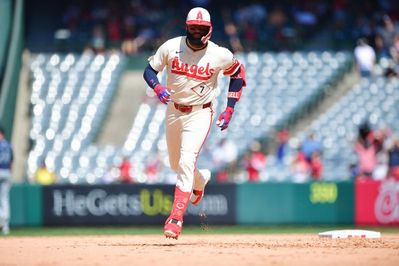 Jul 14, 2024; Anaheim, California, USA; Los Angeles Angels right fielder Jo Adell (7) runs the bases after hitting a three run home run against the Seattle Mariners during the eighth inning at Angel Stadium. Mandatory Credit: Gary A. Vasquez-USA TODAY Sports