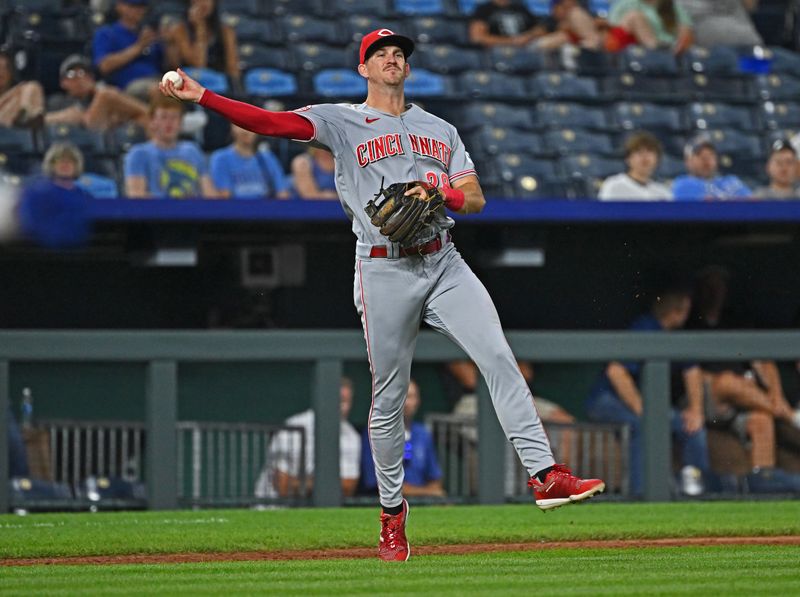 Jun 14, 2023; Kansas City, Missouri, USA;  Cincinnati Reds third baseman Kevin Newman (28) throws the ball to first base in the ninth inning against Kansas City Royals at Kauffman Stadium. Mandatory Credit: Peter Aiken-USA TODAY Sports