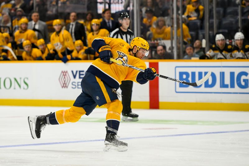 Oct 22, 2024; Nashville, Tennessee, USA;  Nashville Predators center Ryan O'Reilly (90) takes a shot against against the Boston Bruins during the third period at Bridgestone Arena. Mandatory Credit: Steve Roberts-Imagn Images