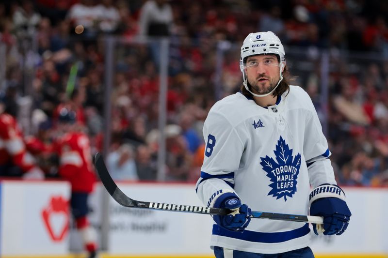 Nov 27, 2024; Sunrise, Florida, USA; Toronto Maple Leafs defenseman Chris Tanev (8) looks on against the Florida Panthers during the second period at Amerant Bank Arena. Mandatory Credit: Sam Navarro-Imagn Images