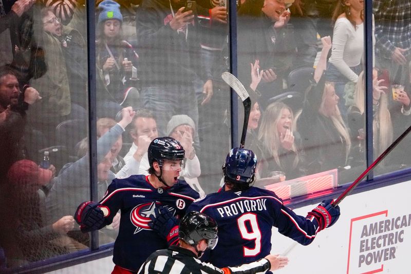 Oct 17, 2024; Columbus, Ohio, USA; Columbus Blue Jackets center Adam Fantilli (19) celebrates with defenseman Ivan Provorov (9) after scoring a goal in the second period at Nationwide Arena on Thursday. Mandatory Credit: Samantha Madar/USA TODAY Network via Imagn Images