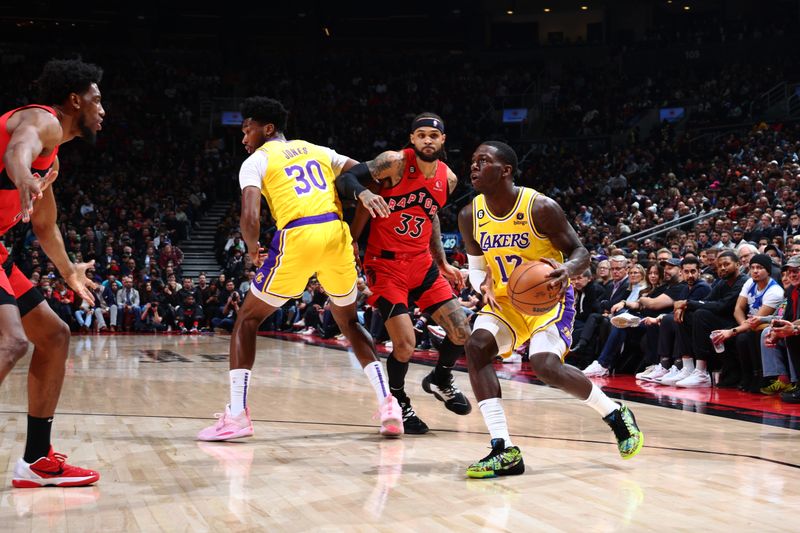 TORONTO, CANADA - DECEMBER 7: Dennis Schroder #17 of the Los Angeles Lakers drives to the basket against the Toronto Raptors on December 7, 2022 at the Scotiabank Arena in Toronto, Ontario, Canada.  NOTE TO USER: User expressly acknowledges and agrees that, by downloading and or using this Photograph, user is consenting to the terms and conditions of the Getty Images License Agreement.  Mandatory Copyright Notice: Copyright 2022 NBAE (Photo by Vaughn Ridley/NBAE via Getty Images)