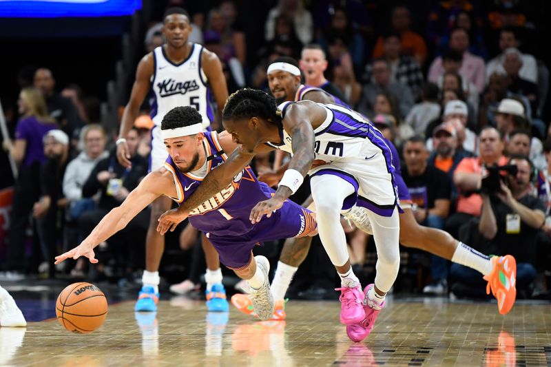 PHOENIX, ARIZONA - NOVEMBER 10: Devin Booker #1 of the Phoenix Suns and Keon Ellis #23 of the Sacramento Kings fight for a loose ball during the first half of the NBA game at Footprint Center on November 10, 2024 in Phoenix, Arizona. NOTE TO USER: User expressly acknowledges and agrees that, by downloading and/or using this photograph, user is consenting to the terms and conditions of the Getty Images License Agreement.  (Photo by Kelsey Grant/Getty Images)